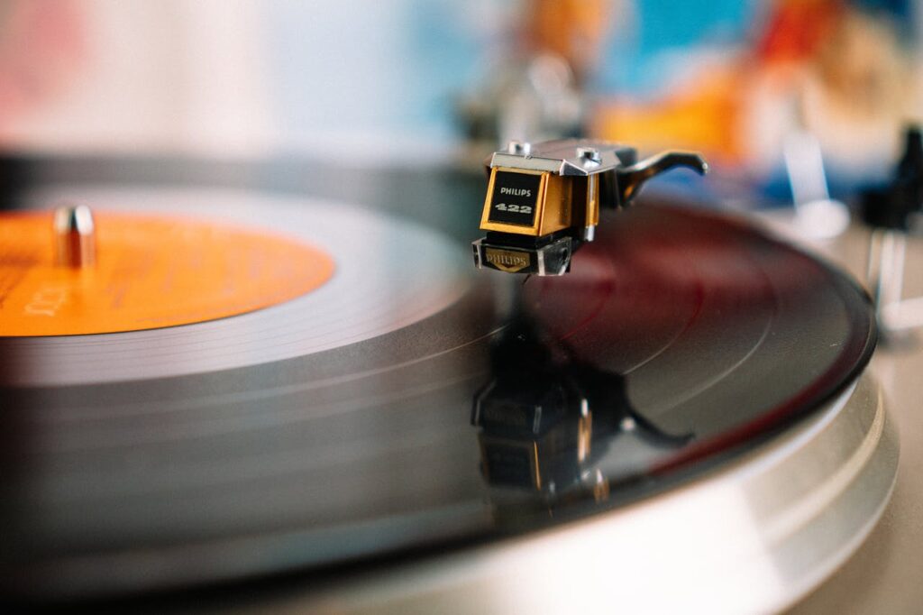 Retro turntable playing vinyl disc in living room